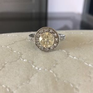 Diamond ring with yellow diamond center stone